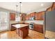 Modern kitchen with stainless steel appliances, an island, and abundant cabinetry offering plenty of storage at 4503 Kendall Way, Roswell, GA 30075