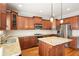 Bright kitchen featuring granite countertops, stainless steel appliances, and wood cabinets at 4503 Kendall Way, Roswell, GA 30075
