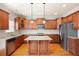 Spacious kitchen with a large granite island, stainless steel appliances, and hardwood floors at 4503 Kendall Way, Roswell, GA 30075