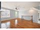 Bright living room featuring gleaming hardwood floors and large windows for ample natural light at 4503 Kendall Way, Roswell, GA 30075