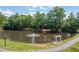 Community pond with a fountain, gazebo, and walking path surrounded by lush landscaping at 4503 Kendall Way, Roswell, GA 30075