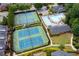 Aerial view of tennis courts and a pool with clubhouse in a beautiful community at 4503 Kendall Way, Roswell, GA 30075
