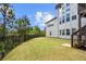Exterior view of backyard featuring fence, lawn, and stairs to deck at 5075 Havenbrooke Ct, Cumming, GA 30040