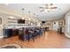 Finished basement featuring a bar with seating, pendant lights, and a pool table at 5075 Havenbrooke Ct, Cumming, GA 30040