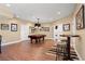 Open finished basement features a pool table, small bar table, and framed sports jerseys at 5075 Havenbrooke Ct, Cumming, GA 30040