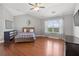 Spacious bedroom featuring wood floors, a vaulted ceiling, and a large window at 5075 Havenbrooke Ct, Cumming, GA 30040