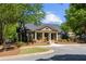 Community clubhouse featuring craftsman details, well manicured landscaping and ample parking at 5075 Havenbrooke Ct, Cumming, GA 30040
