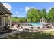 Community pool featuring ample seating, a gazebo, and lush landscaping at 5075 Havenbrooke Ct, Cumming, GA 30040
