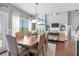 Open concept dining room features hardwood floors, modern décor, and a view to the living room at 5075 Havenbrooke Ct, Cumming, GA 30040