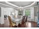 Dining Room boasts hardwood floors, natural light and decorative columns at 5075 Havenbrooke Ct, Cumming, GA 30040