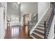 Stunning foyer with high ceilings, hardwood floors, and staircase with wrought iron railing at 5075 Havenbrooke Ct, Cumming, GA 30040