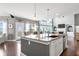 Open concept kitchen with granite countertops and a view of the living room at 5075 Havenbrooke Ct, Cumming, GA 30040