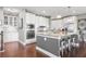 Bright, modern kitchen with white cabinets, stainless steel appliances and granite countertops at 5075 Havenbrooke Ct, Cumming, GA 30040