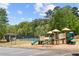 Community playground with a tennis court, playground equipment, picnic area and parking at 5075 Havenbrooke Ct, Cumming, GA 30040