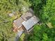 Aerial view of the home showcasing mature trees and wooden decks at 609 Redwood Drive Dr, Woodstock, GA 30189