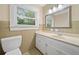 Bathroom with vanity, white cabinets, and a window with natural light at 609 Redwood Drive Dr, Woodstock, GA 30189
