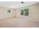 Spacious bedroom with large windows providing natural light and a ceiling fan at 609 Redwood Drive Dr, Woodstock, GA 30189