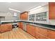 Updated kitchen features stainless steel appliances, granite countertops, and abundant cabinet space at 609 Redwood Drive Dr, Woodstock, GA 30189