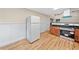 Well lit kitchen with stainless appliances, hardwood floors, and open floor plan at 609 Redwood Drive Dr, Woodstock, GA 30189