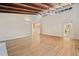 Bright, open-concept living room with hardwood floors, vaulted ceilings, and seamless flow to kitchen and bath at 609 Redwood Drive Dr, Woodstock, GA 30189