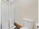 Bathroom featuring a glass-enclosed shower with white tile and a white toilet at 609 Redwood Drive Dr, Woodstock, GA 30189