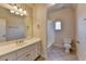 Bathroom featuring tile flooring, a tub-shower combo, and a large vanity with a mirror at 10125 Brixton Pl, Suwanee, GA 30024