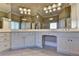 Bright bathroom boasts double vanity, ample lighting, and plenty of storage at 10125 Brixton Pl, Suwanee, GA 30024