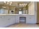 Bright bathroom boasts double vanity, ample lighting, and plenty of storage at 10125 Brixton Pl, Suwanee, GA 30024
