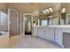 Well-lit bathroom featuring a walk-in shower and lots of counter space at 10125 Brixton Pl, Suwanee, GA 30024