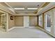 Bonus room showcasing an open layout with neutral walls and doors leading to other areas of the house at 10125 Brixton Pl, Suwanee, GA 30024
