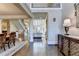 Spacious foyer featuring hardwood floors and access to staircase and living room at 10125 Brixton Pl, Suwanee, GA 30024