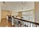 Hallway with hardwood floors leads to an open floor plan with lots of natural light at 10125 Brixton Pl, Suwanee, GA 30024