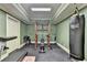 Well-equipped home gym with modern exercise equipment and a punching bag for a complete fitness experience at 10125 Brixton Pl, Suwanee, GA 30024