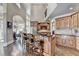 This kitchen boasts stainless steel appliances, a spacious island with seating, and an attached dining area at 10125 Brixton Pl, Suwanee, GA 30024