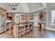 Spacious kitchen features custom wood cabinets, stainless steel appliances, and a large island with seating at 10125 Brixton Pl, Suwanee, GA 30024