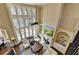 Open floor plan featuring an elegant living room with many windows and lots of natural light at 10125 Brixton Pl, Suwanee, GA 30024
