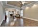 Expansive living room with a fireplace, hardwood floors, and abundant natural light, perfect for relaxation and entertaining at 10125 Brixton Pl, Suwanee, GA 30024