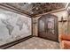 Luxurious wine cellar featuring intricate ceiling details, tiled flooring, and elegant wine storage at 10125 Brixton Pl, Suwanee, GA 30024