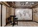Wine cellar featuring a map on the wall, tiled flooring and high ceilings at 10125 Brixton Pl, Suwanee, GA 30024