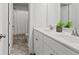 Bathroom featuring a double sink vanity with a neutral shower and toilet at 242 Crestbrook Ln, Dallas, GA 30157