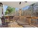 View of a wooden deck with railing, outdoor furniture, and wooded scenery at 242 Crestbrook Ln, Dallas, GA 30157