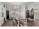 Dining room featuring a large window and hardwood floors at 242 Crestbrook Ln, Dallas, GA 30157