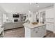 Modern kitchen with island, stainless steel appliances, and open view to the living room at 242 Crestbrook Ln, Dallas, GA 30157
