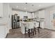 Modern kitchen with white cabinets, stainless steel appliances, and a center island with seating at 242 Crestbrook Ln, Dallas, GA 30157