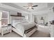 Main bedroom with a ceiling fan, carpet, and natural light at 242 Crestbrook Ln, Dallas, GA 30157