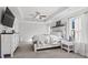 Main bedroom featuring a tray ceiling, carpet, and natural light at 242 Crestbrook Ln, Dallas, GA 30157