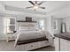 Main bedroom with tray ceiling, carpet, and natural light at 242 Crestbrook Ln, Dallas, GA 30157