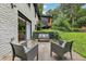 Landscaped backyard with patio area and comfortable seating area offering great views of the outdoor space at 3356 Thornewood Dr, Atlanta, GA 30340