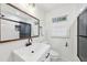 Updated bathroom featuring a new vanity, mirror, and walk-in shower with black trim at 3356 Thornewood Dr, Atlanta, GA 30340