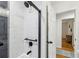 Bathroom shower featuring tiled walls and a door to the hallway at 3356 Thornewood Dr, Atlanta, GA 30340